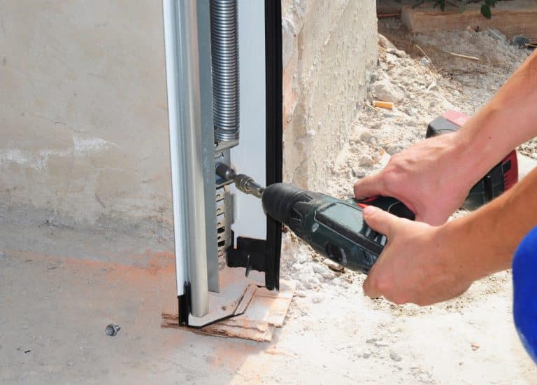 how much tension is on a garage door spring
