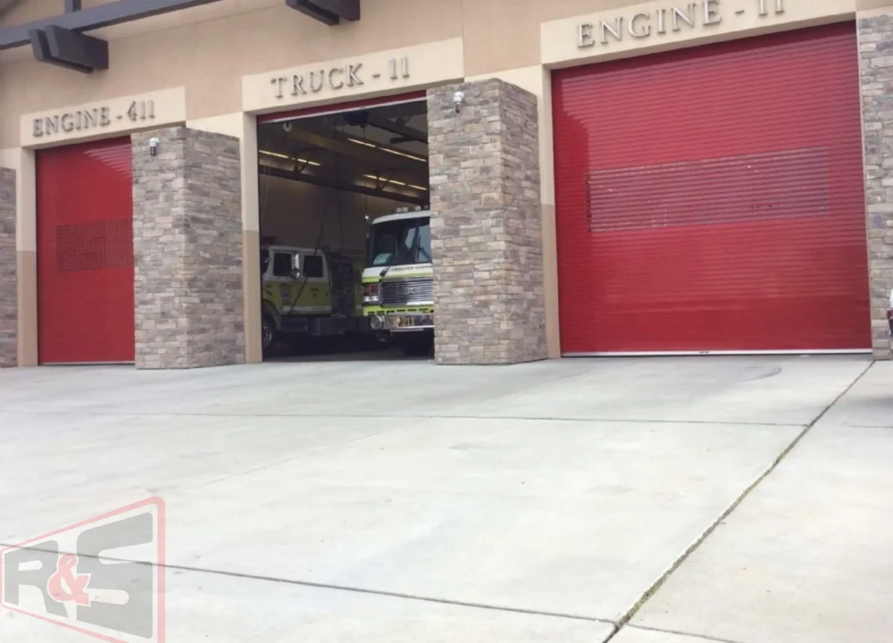 Bright red heavy-duty roll-up fire station bay doors representing Commercial Garage Doors in Vallejo, CA.
